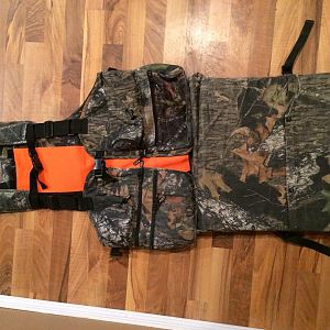 This is a LG Gander Mountain turkey vest in Mossy Oak Break Up. Has fully padded flip down seat. I upgraded a few years back and this has been sitting