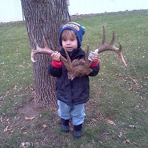 My son holding antlers for the fist time