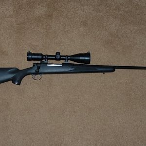 Rem700 .30-06 with factory synthetic stock after 2nd trip to gunsmith.