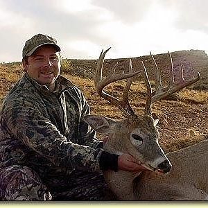 Archery brow tine buck in rough wyoming antelope like country.